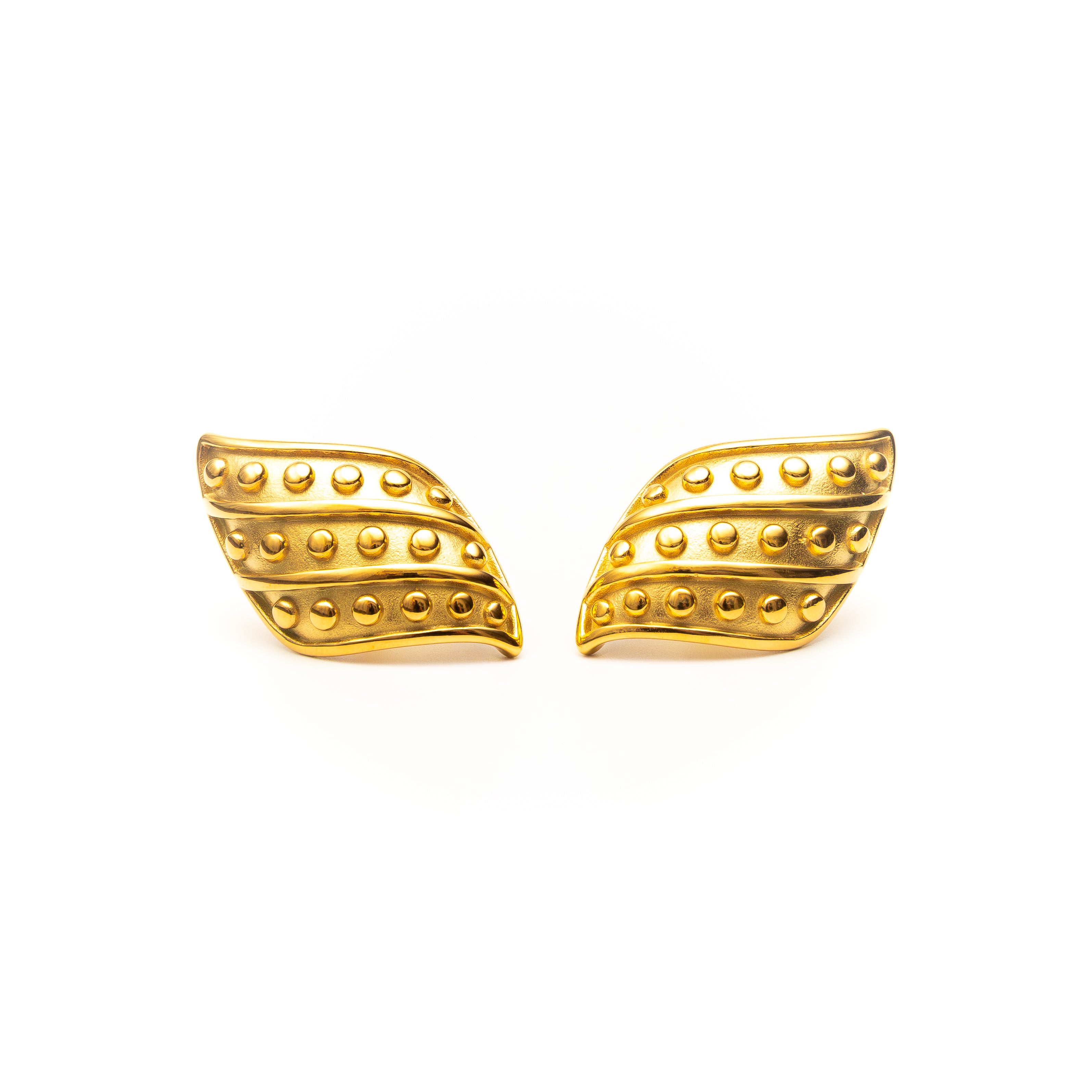 Pair of gold wing-shaped earrings on a white background