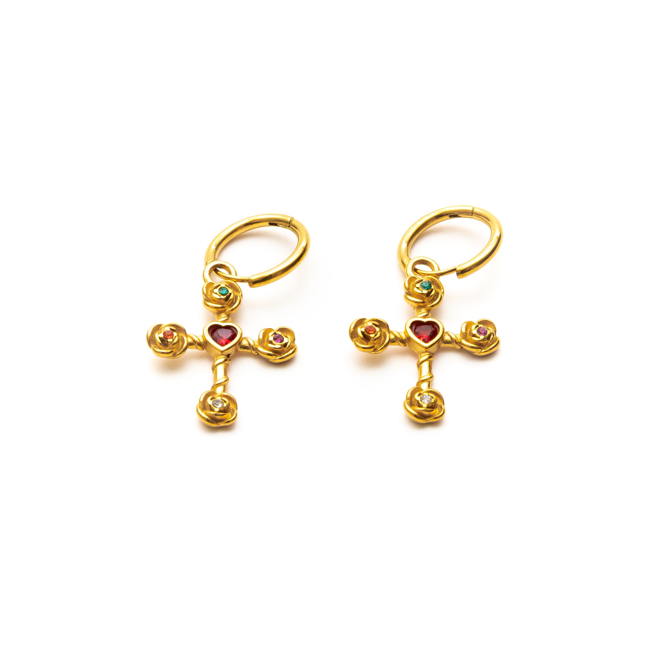 Gold cross-shaped earrings with heart and gemstone details on a white background