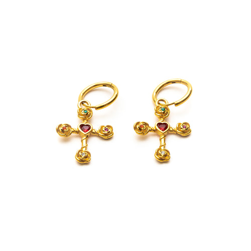 Gold cross-shaped earrings with heart and gemstone details on a white background