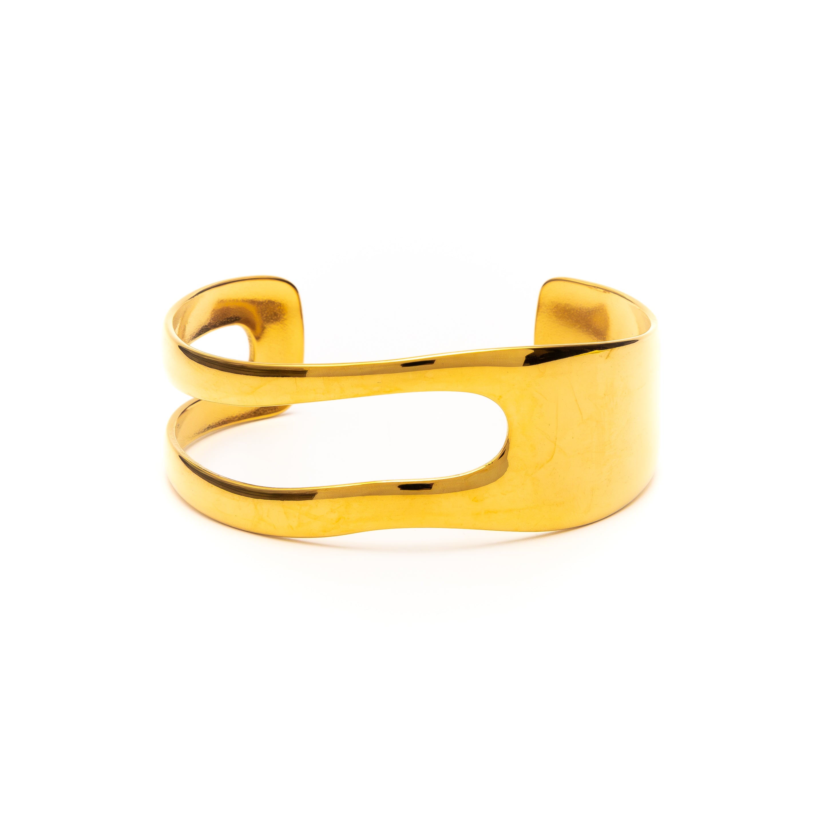 Gold open cuff bracelet on a white background