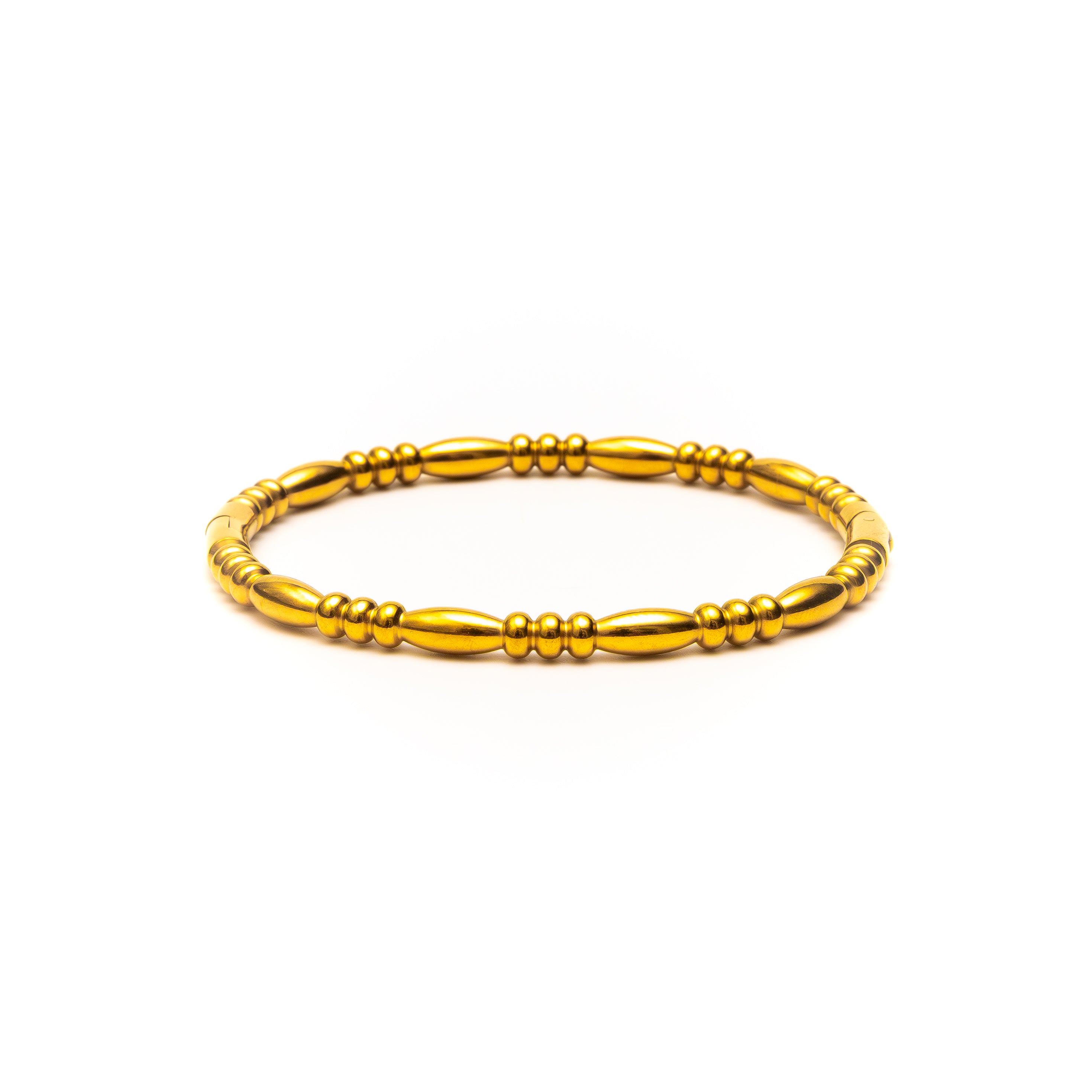 Gold bracelet on a white background