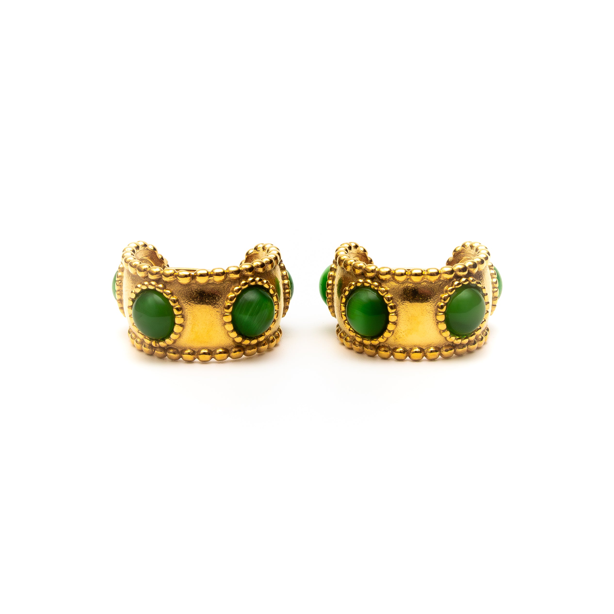 Gold earrings with green stones on a white background