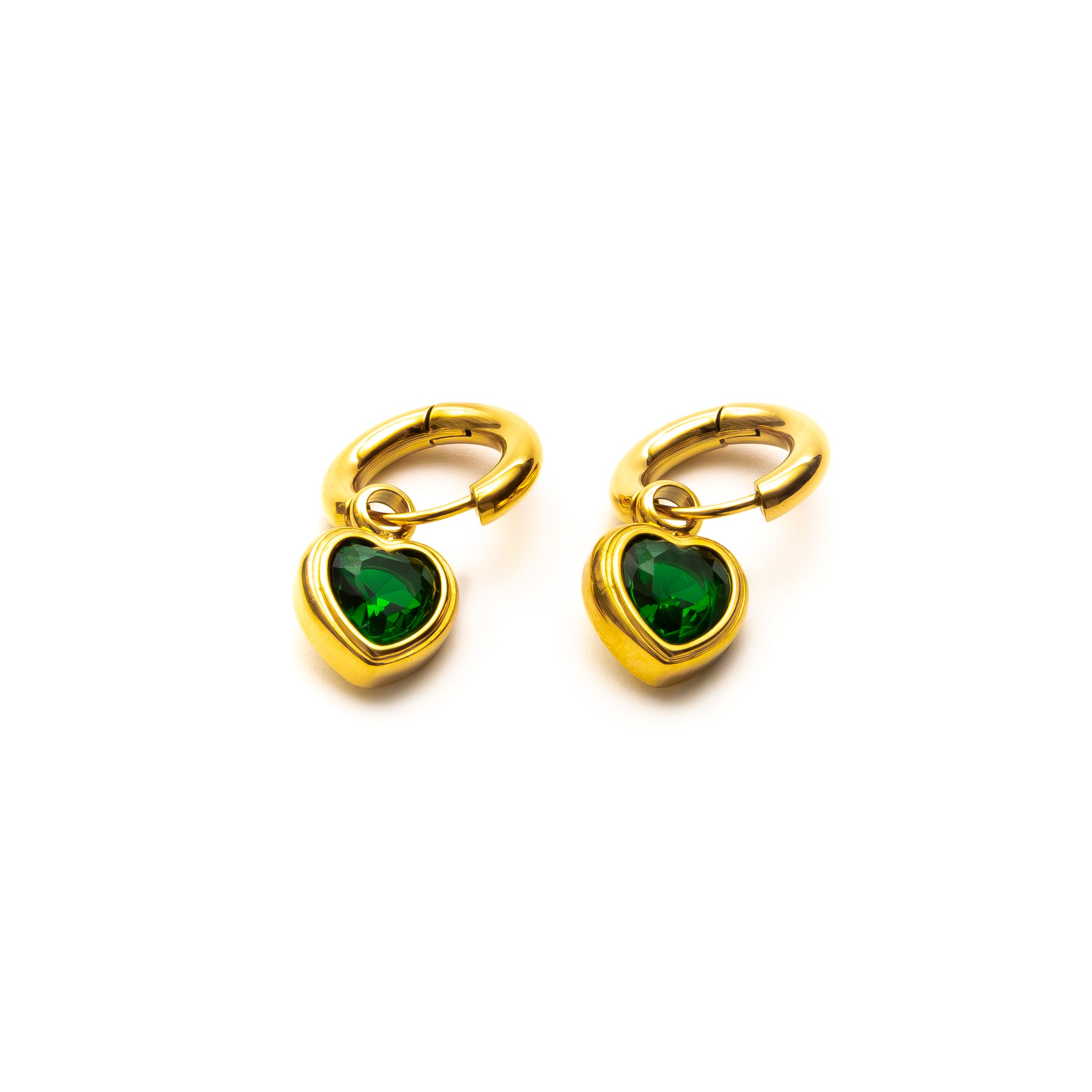 Gold earrings with green heart-shaped stones on a white background
