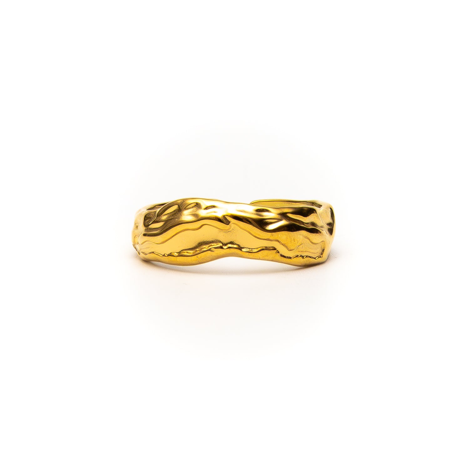 Gold ring with wavy design on a white background