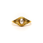 Gold ring with a pearl on a white background