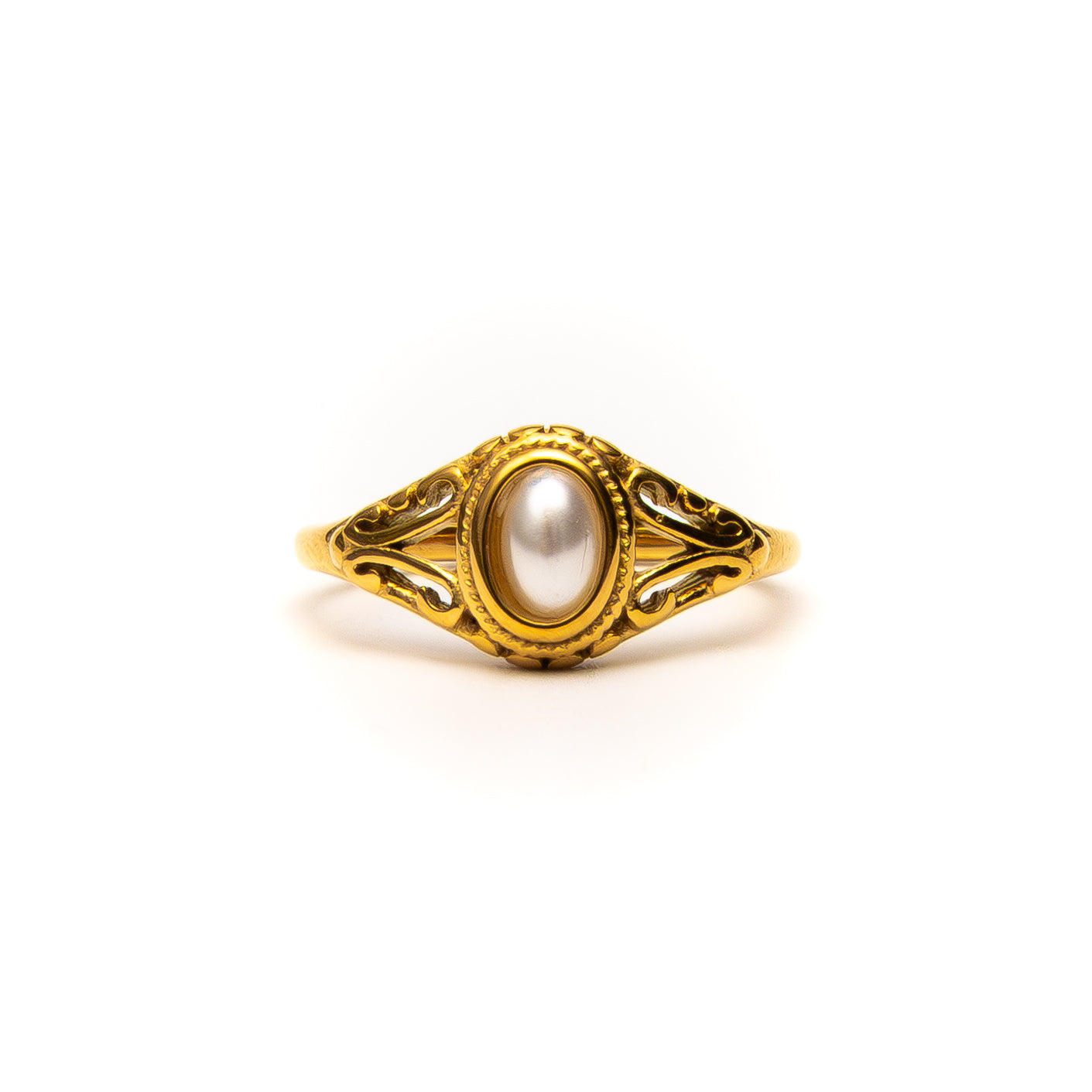 Gold ring with a pearl on a white background