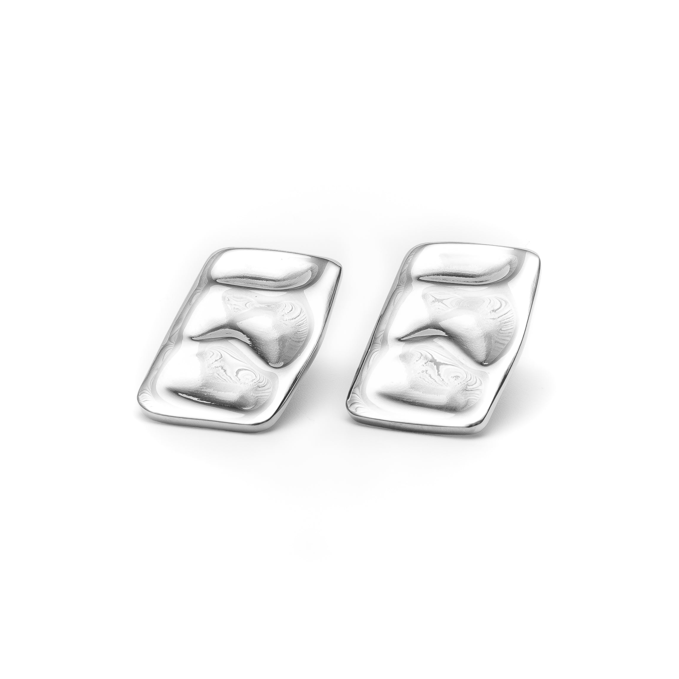 Pair of silver earrings on a white background