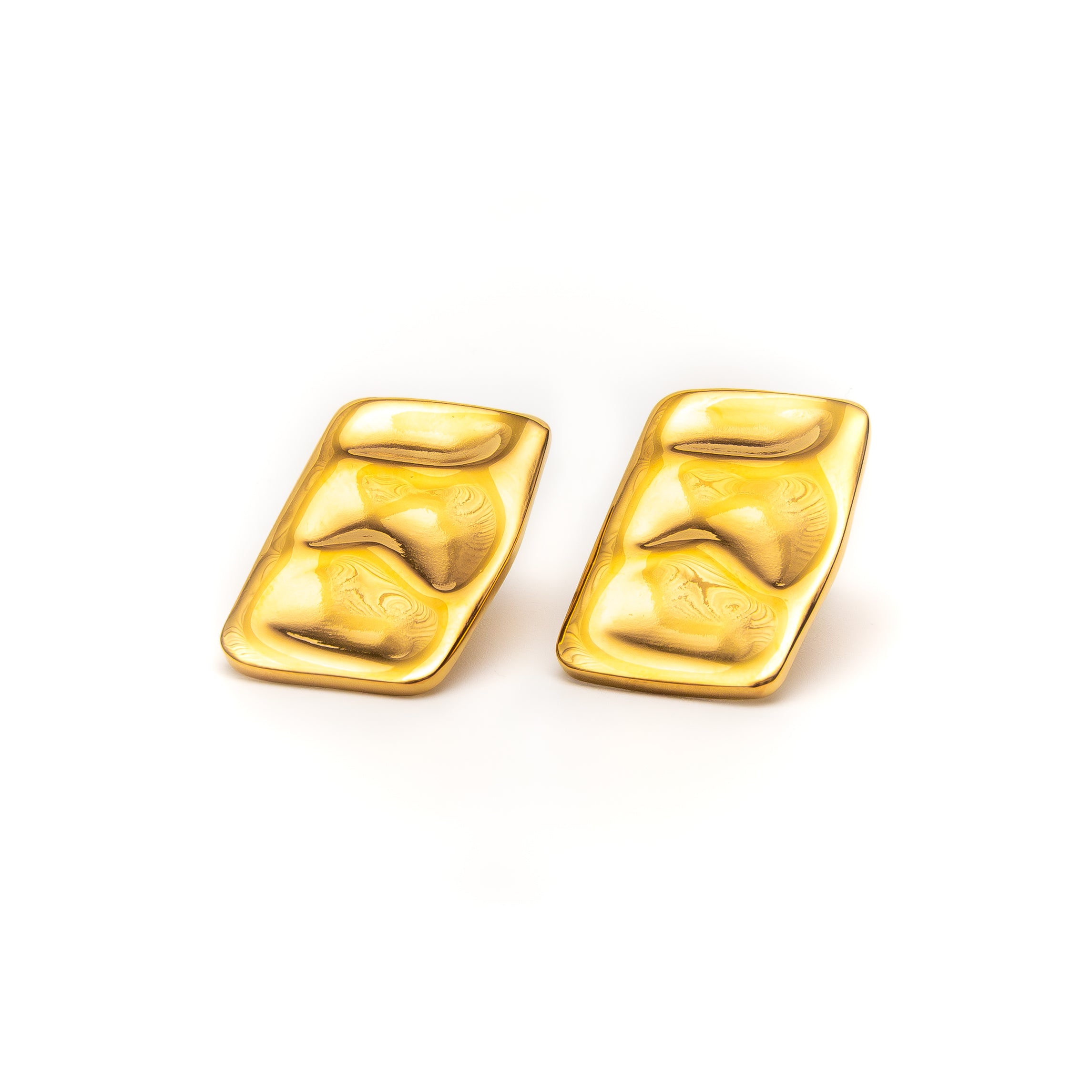 Pair of gold earrings on a white background