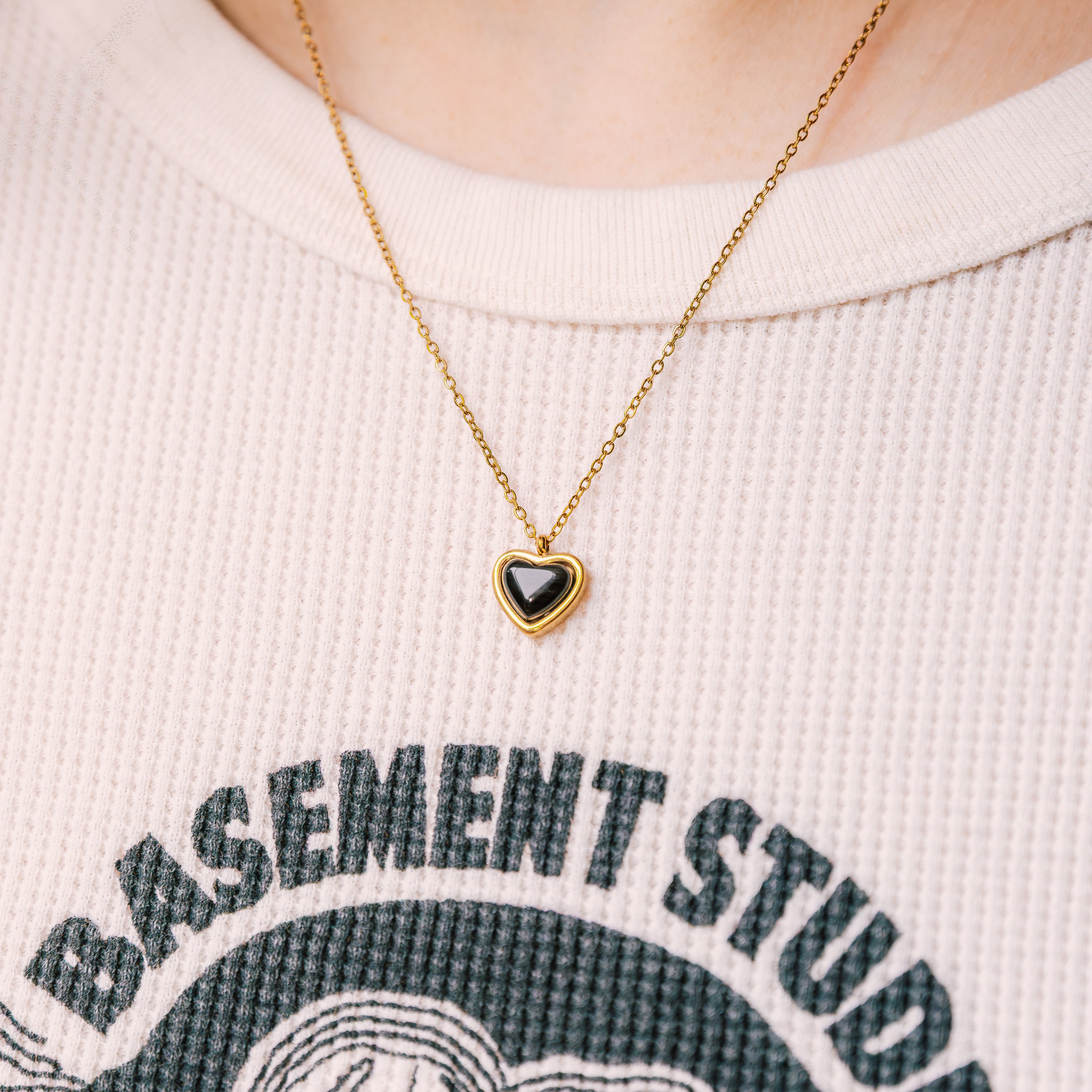 Black Heart Necklace gold necklace for women on white background