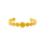 Gold bracelet with floral patterns on a white background