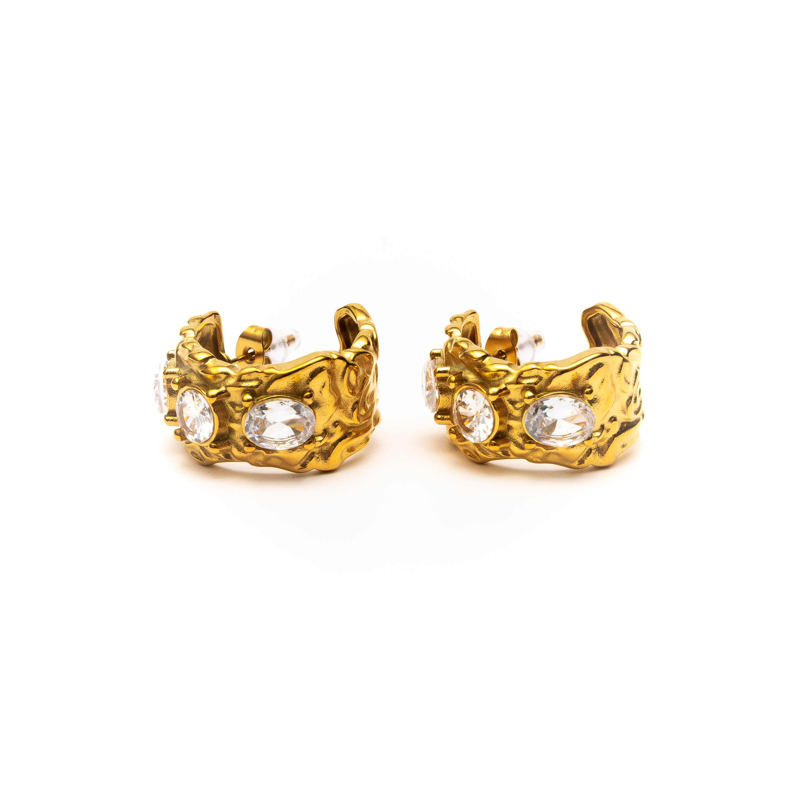 Gold hoop earrings with embedded crystals on a white background