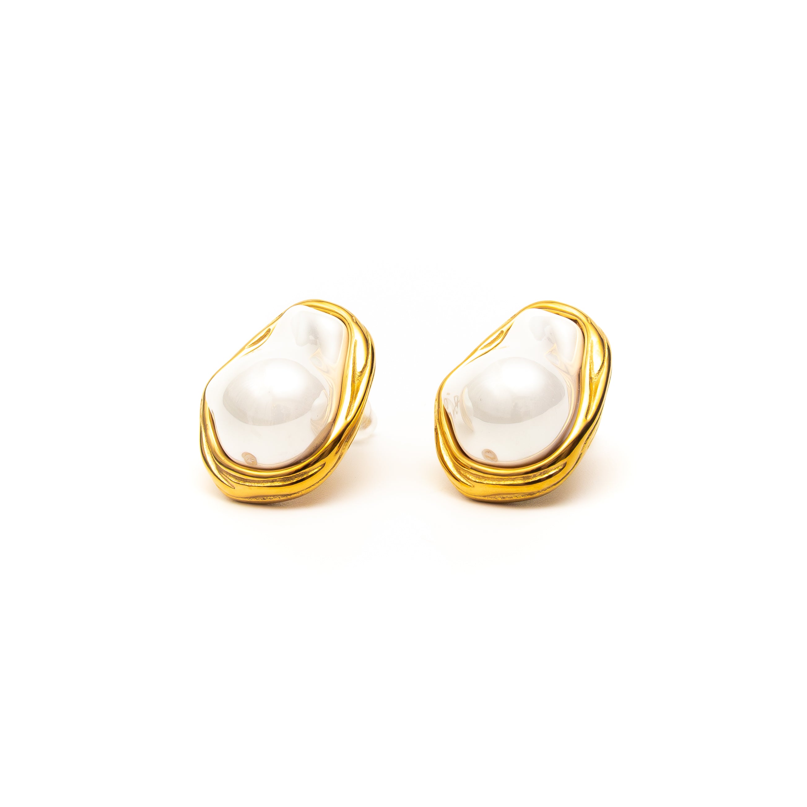 Pair of earrings with gold accents and white stones on a white background