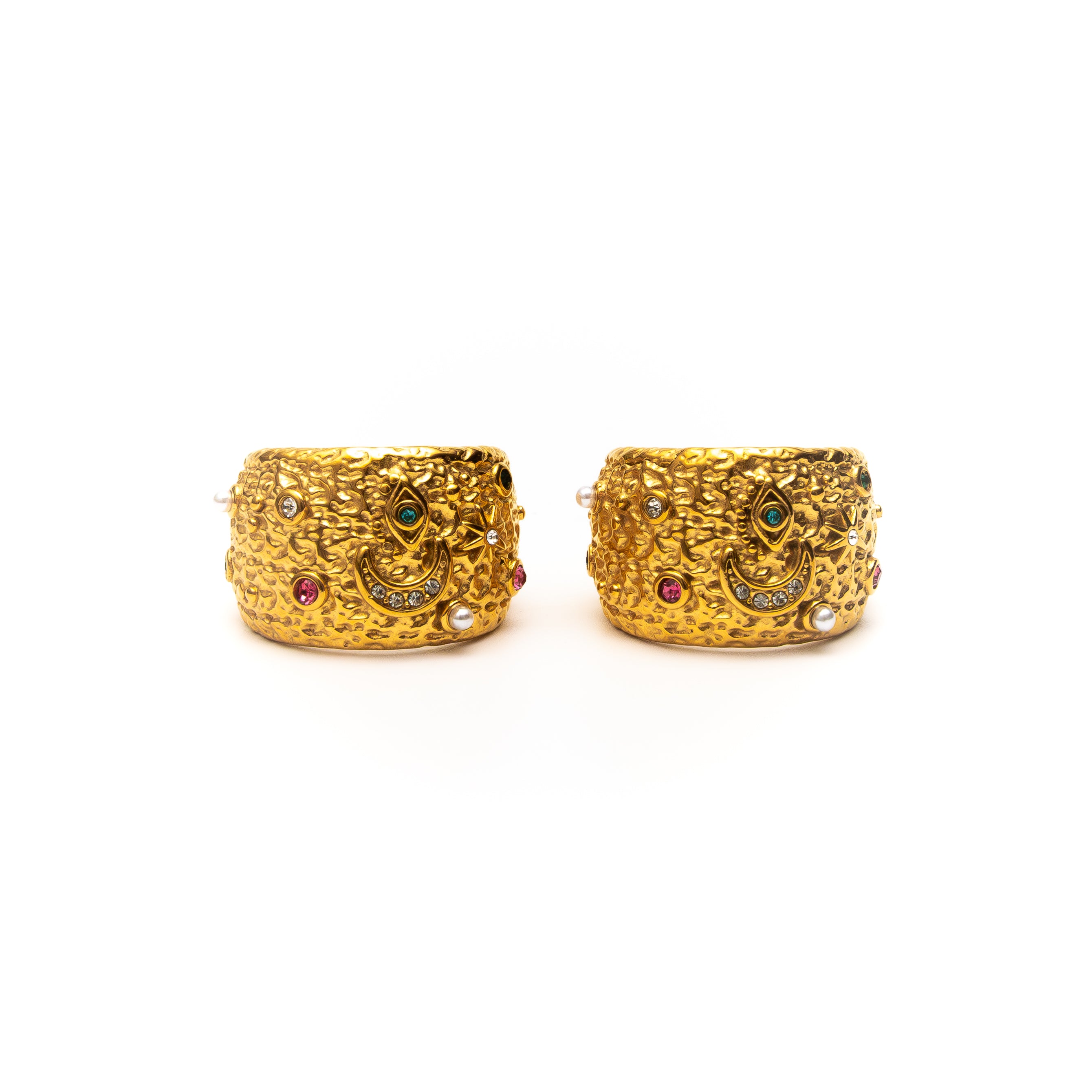 Pair of gold hoop earrings with embedded gemstones on a white background