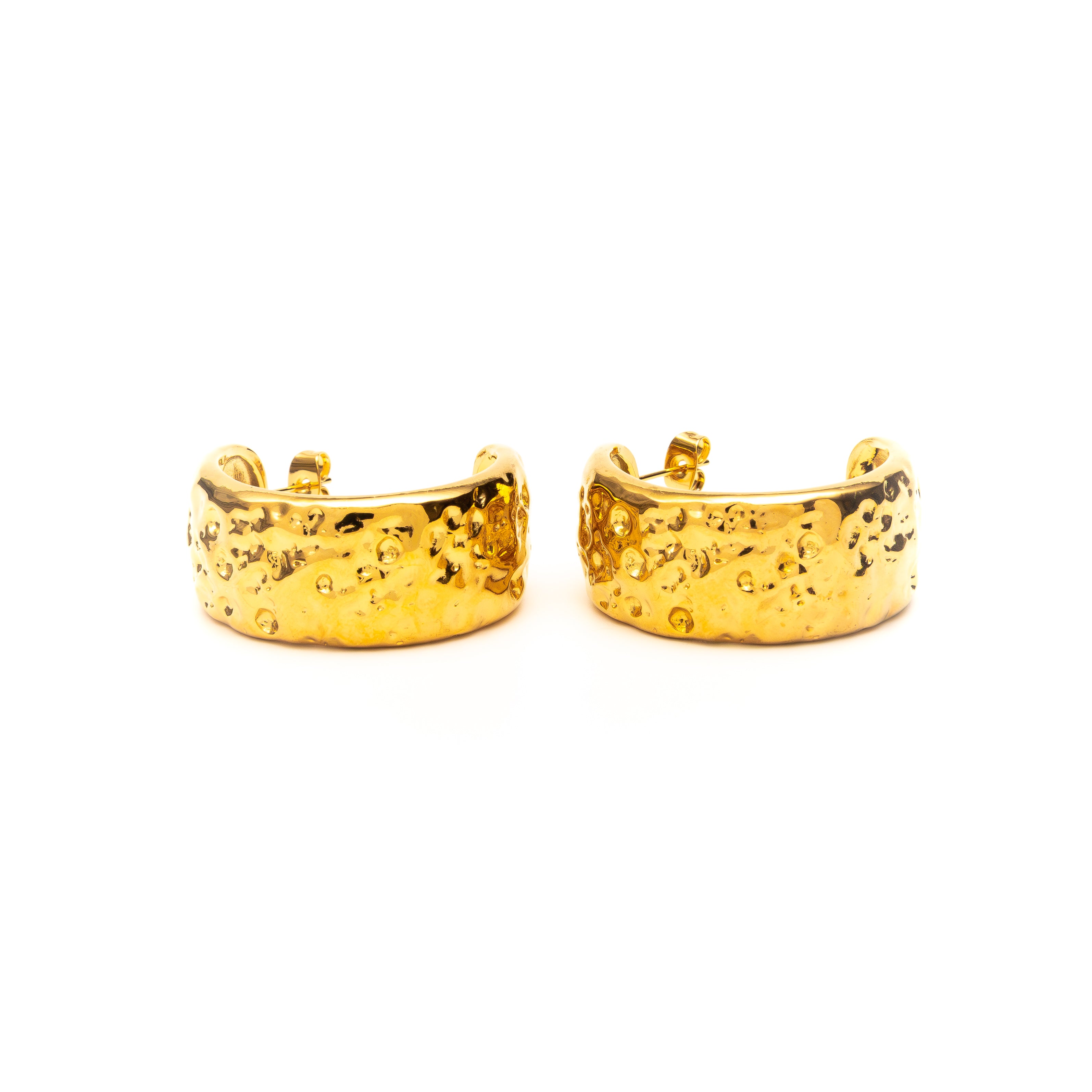 Pair of gold hoop earrings on a white background