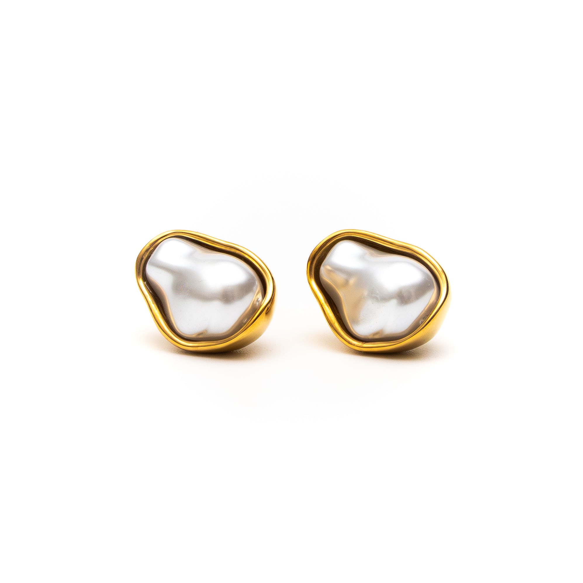 Pair of gold-framed pearl earrings on a white background